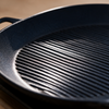 Close-up of the ridged non-stick cooking surface of the grill pan