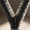 Close-up into the V-shaped bristle head showing the angled rows and centre channel
