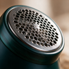 Close-up of the honeycomb grille and blades on the lint remover head