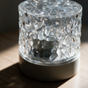 Close-up of the faceted crystal body and base controls on the ripple projector