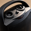 Close-up of the heater's two control dials and carry handle